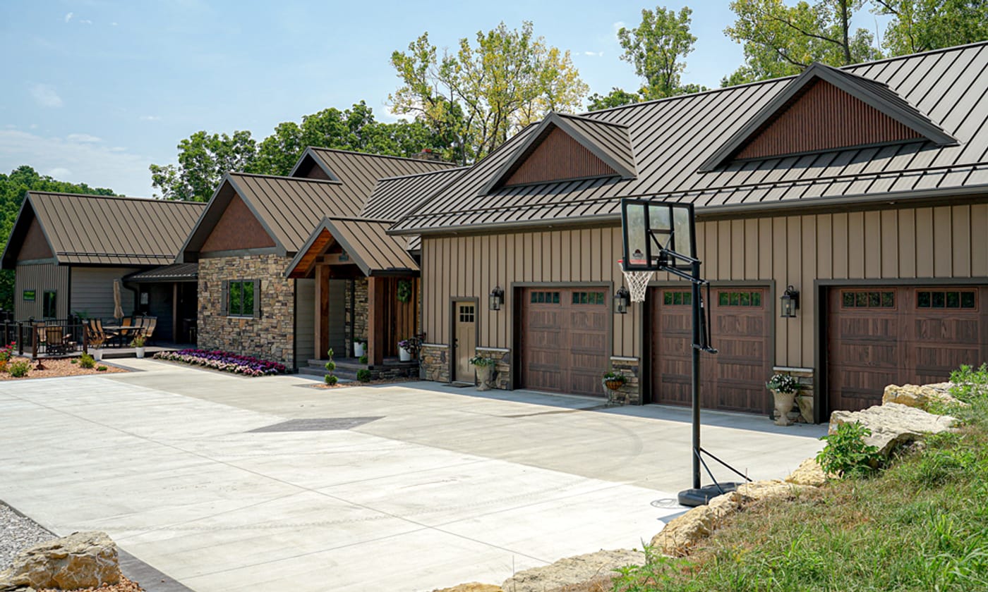 Brown metal barndominium with matching metal roof